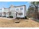 Attractive two-story townhouse featuring a well-manicured lawn and a tree-lined backyard at 1286 Brookins Trl, Atlanta, GA 30316