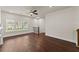 Cozy living room featuring hardwood floors, a ceiling fan, and natural light at 1286 Brookins Trl, Atlanta, GA 30316