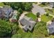 A lovely aerial view showcasing the home, lush trees, pool, and surrounding neighborhood at 2115 Brook Pond Ct, Alpharetta, GA 30005