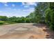 A basketball court with a clean surface and mature greenery around at 2115 Brook Pond Ct, Alpharetta, GA 30005