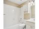 Bright bathroom with white tile, shower and tub combination, and vanity with storage at 2115 Brook Pond Ct, Alpharetta, GA 30005
