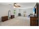 A spacious main bedroom with carpet floors and two windows for plenty of natural light at 2115 Brook Pond Ct, Alpharetta, GA 30005