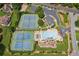 Aerial view of community amenities including tennis courts and a large swimming pool, for active residents at 2115 Brook Pond Ct, Alpharetta, GA 30005