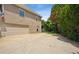 Attached two-car garage with a large driveway and a small garden in the backyard at 2115 Brook Pond Ct, Alpharetta, GA 30005
