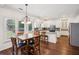 Bright kitchen with a dining nook, a center island and stainless steel appliances at 2115 Brook Pond Ct, Alpharetta, GA 30005