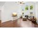 Spacious living room with vaulted ceilings, fireplace, and large windows providing plenty of natural light at 2115 Brook Pond Ct, Alpharetta, GA 30005