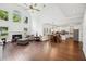 An open floor plan featuring a living room with fireplace and dining area with a combined kitchen at 2115 Brook Pond Ct, Alpharetta, GA 30005