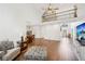 Open floor plan showcasing the living room, dining area, and entryway, with vaulted ceilings and lots of light at 2115 Brook Pond Ct, Alpharetta, GA 30005
