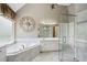 Beautiful bathroom features a jacuzzi tub and a glass walk-in shower with white marble tiles at 2115 Brook Pond Ct, Alpharetta, GA 30005