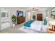 Well-staged main bedroom with a king bed, wooden furniture, and a view to the main bathroom at 2115 Brook Pond Ct, Alpharetta, GA 30005