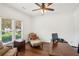 Cozy home office featuring natural light from the windows, and a ceiling fan at 2115 Brook Pond Ct, Alpharetta, GA 30005