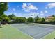 A well-maintained tennis courts in the community surrounded by mature trees at 2115 Brook Pond Ct, Alpharetta, GA 30005