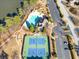 Aerial view of community tennis courts, parking lot and playground at 1102 White Cloud Rdg, Snellville, GA 30078