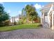 A beautiful backyard with a lush green lawn and a brick paver patio at 1102 White Cloud Rdg, Snellville, GA 30078