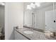 Bright bathroom with granite countertops and a large mirror at 1102 White Cloud Rdg, Snellville, GA 30078