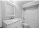Bathroom featuring a vanity with a marble countertop and a shower/tub combo at 1102 White Cloud Rdg, Snellville, GA 30078