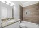 Bathroom featuring granite countertop and a tub shower with decorative tile surround at 1102 White Cloud Rdg, Snellville, GA 30078