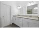 Bathroom with double vanity, granite countertop, and ample storage at 1102 White Cloud Rdg, Snellville, GA 30078