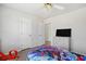 This bedroom features a ceiling fan, crisp white walls, and hardwood floors at 1102 White Cloud Rdg, Snellville, GA 30078