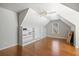 Bedroom featuring built-in shelving, hardwood floors, a ceiling fan, and great natural light at 1102 White Cloud Rdg, Snellville, GA 30078