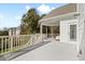 Wide outdoor deck with white railings, ceiling fan, and seating area perfect for relaxing at 1102 White Cloud Rdg, Snellville, GA 30078