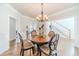 Elegant dining room with chandelier and hardwood floors at 1102 White Cloud Rdg, Snellville, GA 30078