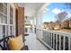 Relaxing covered porch with white columns and neighborhood views at 1102 White Cloud Rdg, Snellville, GA 30078
