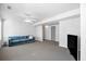 Finished living room with carpet, neutral walls, and a comfortable sofa at 1102 White Cloud Rdg, Snellville, GA 30078