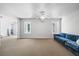 Living room with neutral carpet, white walls, and bright natural light at 1102 White Cloud Rdg, Snellville, GA 30078