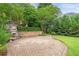 Landscaped patio area with brick pavers and an outdoor fireplace at 1102 White Cloud Rdg, Snellville, GA 30078