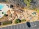 Aerial view of the community playground near the parking lot and pool area at 1102 White Cloud Rdg, Snellville, GA 30078