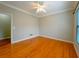 Bright bedroom featuring hardwood floors, crown molding, and a ceiling fan at 3195 Vickery Ne Dr, Marietta, GA 30066