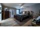 Comfortable bedroom features a ceiling fan, a large bed, and natural light from the window at 2376 Allman Dr, Jonesboro, GA 30236
