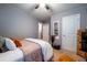 Comfortable bedroom featuring a ceiling fan, neutral wall color, and carpeted floor at 2376 Allman Dr, Jonesboro, GA 30236