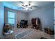 Spacious bedroom with ample natural light, a ceiling fan, and neutral carpet at 2376 Allman Dr, Jonesboro, GA 30236