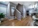 Entryway with wood floors, staircase, mirror, and view to kitchen and dining at 2376 Allman Dr, Jonesboro, GA 30236
