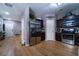 Open kitchen boasts stainless steel appliances, dark cabinetry, and wood-look flooring at 2376 Allman Dr, Jonesboro, GA 30236