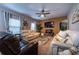 Cozy living room with a ceiling fan, stylish decor, and comfortable couches at 2376 Allman Dr, Jonesboro, GA 30236
