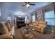 Spacious living room with comfortable seating and view to dining area and kitchen at 2376 Allman Dr, Jonesboro, GA 30236