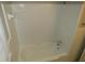 This bathroom features a white tiled shower/tub at 2630 Colonial Dr, College Park, GA 30337