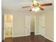 This bedroom features hardwood floors, a closet, and an ensuite bathroom at 2630 Colonial Dr, College Park, GA 30337