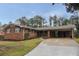 Charming brick home with a covered carport and a well-maintained front yard in a suburban setting at 2630 Colonial Dr, College Park, GA 30337