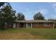 A single story brick home with sliding glass doors and a large yard at 2630 Colonial Dr, College Park, GA 30337