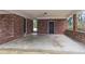 Spacious covered area featuring brick columns and room for parking several vehicles at 2630 Colonial Dr, College Park, GA 30337