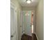Hallway with a door with a semi-circular window leading to the outside, bringing in natural light at 2630 Colonial Dr, College Park, GA 30337