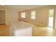 Open-concept kitchen area featuring an island with granite countertops and a seamless transition to the living space at 2630 Colonial Dr, College Park, GA 30337