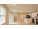 Bright, renovated kitchen featuring white cabinets, granite countertops, and modern black appliances at 2630 Colonial Dr, College Park, GA 30337