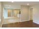 Inviting open-concept living area with stylish flooring, neutral walls, and seamless flow to the kitchen at 2630 Colonial Dr, College Park, GA 30337