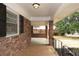 Covered porch with brick columns, offering a great space for outdoor relaxation and enjoyment at 2630 Colonial Dr, College Park, GA 30337