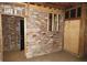 Unfinished area showcasing brick and framework, providing an opportunity to build out a space at 2630 Colonial Dr, College Park, GA 30337